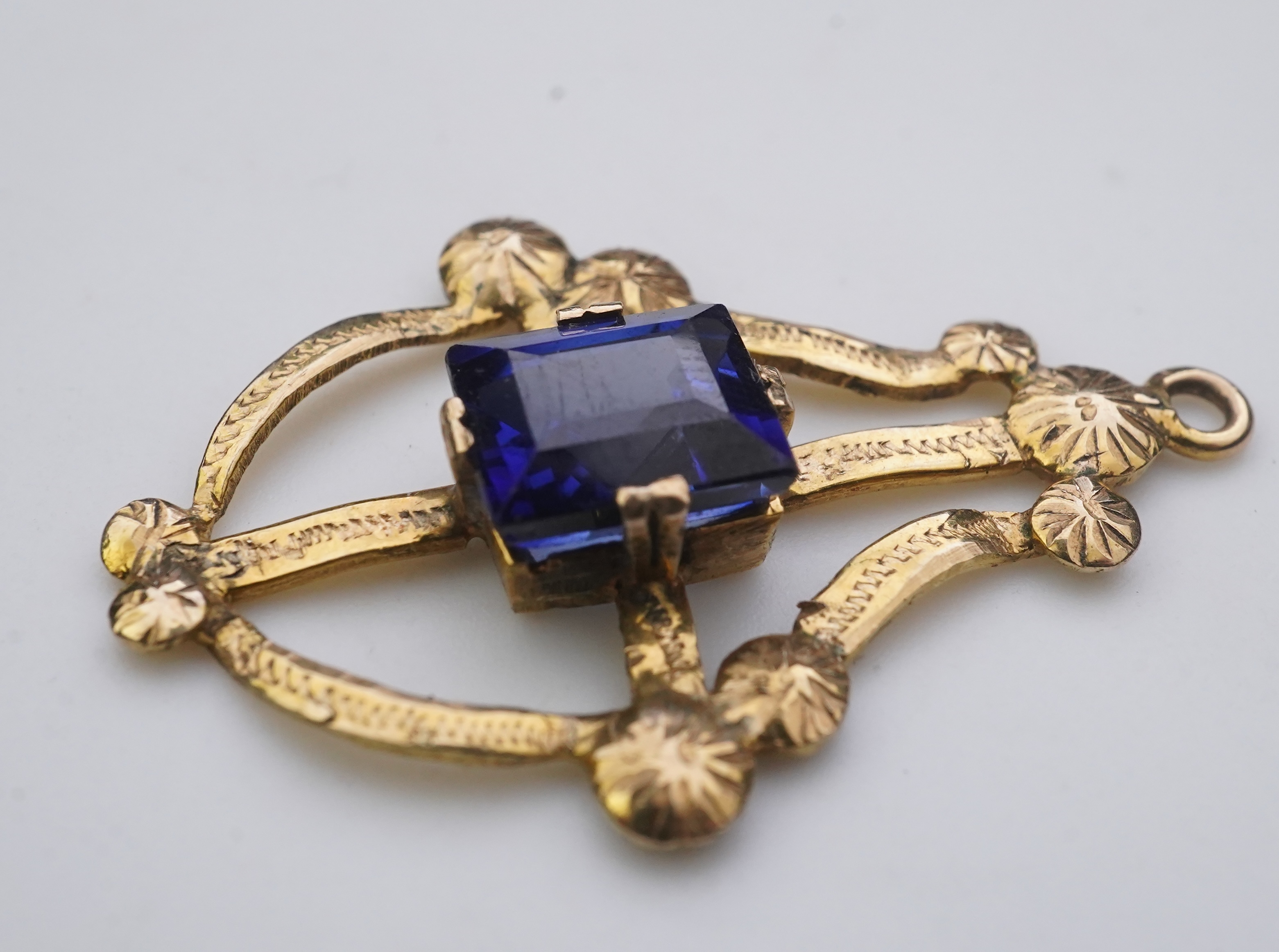 A collection of three brooches and a pendant, 19th and 20th century